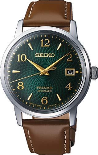 Seiko watch with a green dial and brown leather strap